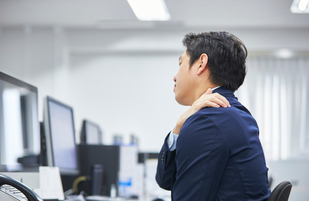 man in office with tech neck
